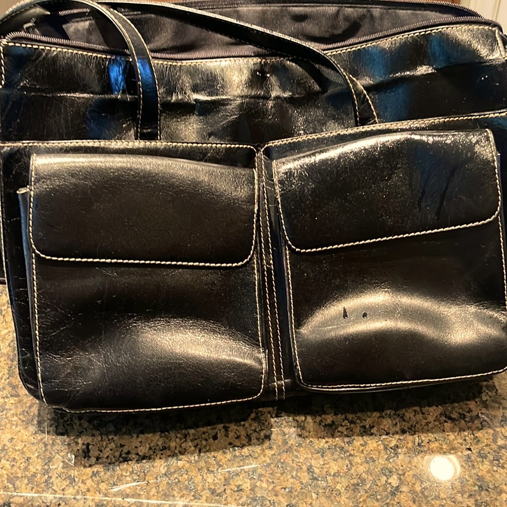 Leather black Preston York trimmed in one zippered with front  magnet pouches